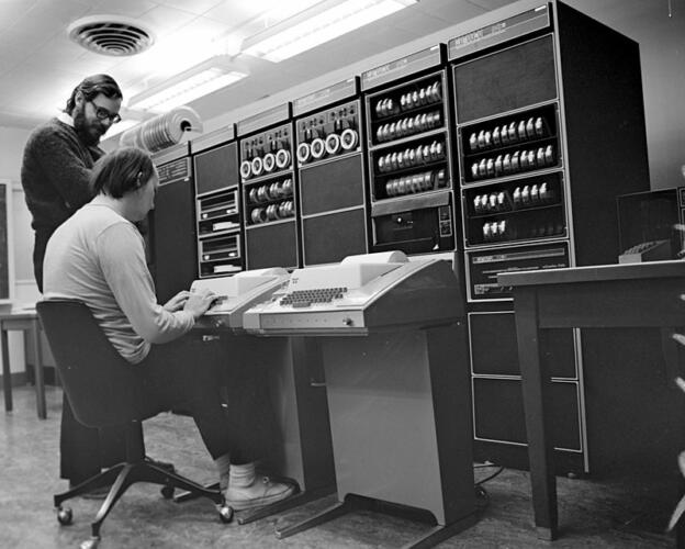 Ken Thompson sitting and Dennis Ritchie at PDP 11 2876612463